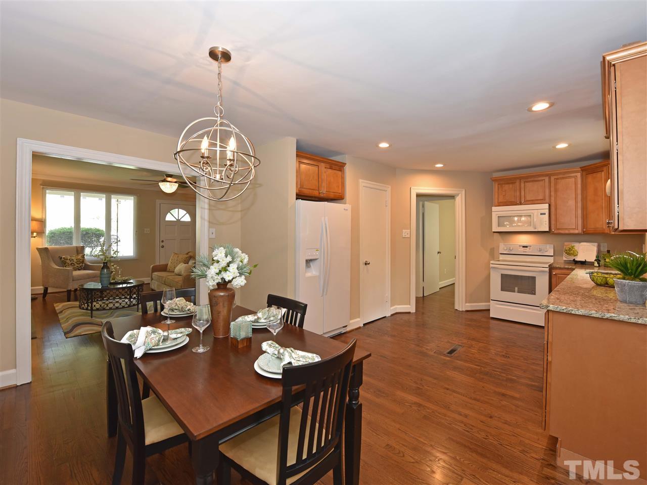 726 South State Street Raleigh, NC 27601 - Photo 8 of 25 a large kitchen with a table and chairs