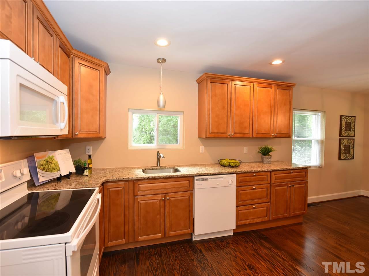 726 South State Street Raleigh, NC 27601 - Photo 9 of 25 a kitchen with a sink a window and cabinets