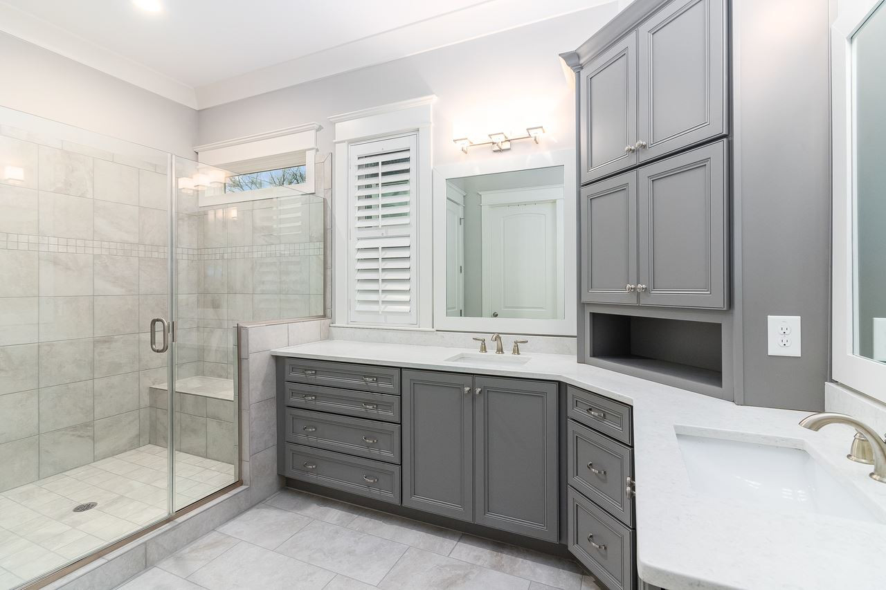 701 Virginia Avenue Raleigh, NC 27604 - Photo 7 of 16 Not your average en suite, this master bath boasts amazing storage, dual vanity, gorgeous tile and a large walk-in shower with bench. Master Bath/Spa