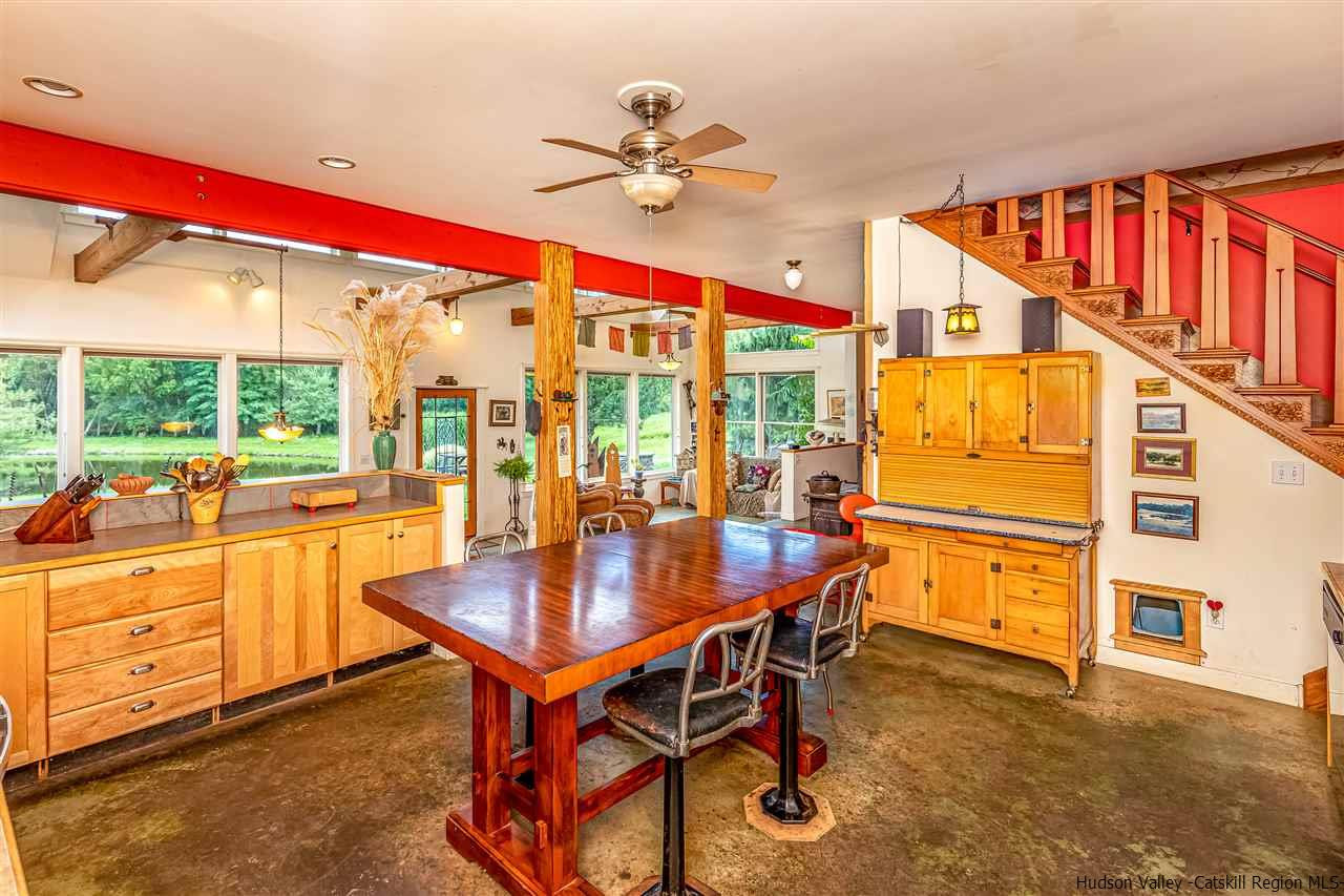 151 Wilhelm Road Saugerties, NY 12477 - Photo 12 of 35 a dining room with furniture and a floor to ceiling window
