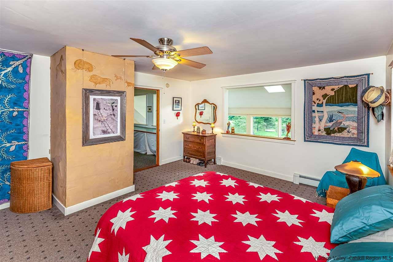 151 Wilhelm Road Saugerties, NY 12477 - Photo 20 of 35 a bedroom with a bed and wooden floor