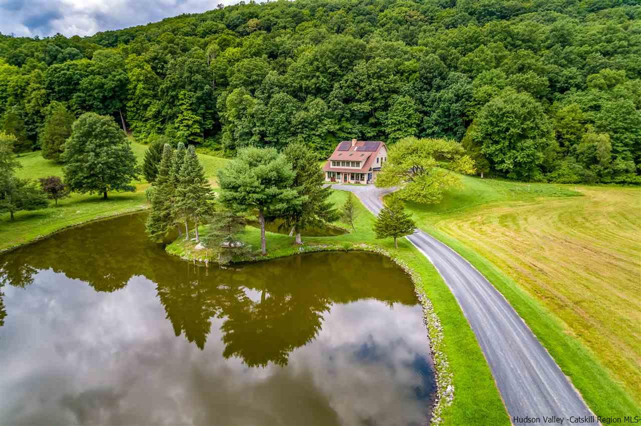 151 Wilhelm Road Saugerties, NY 12477 - Photo 2 of 35 a view of a lake with a yard and large trees