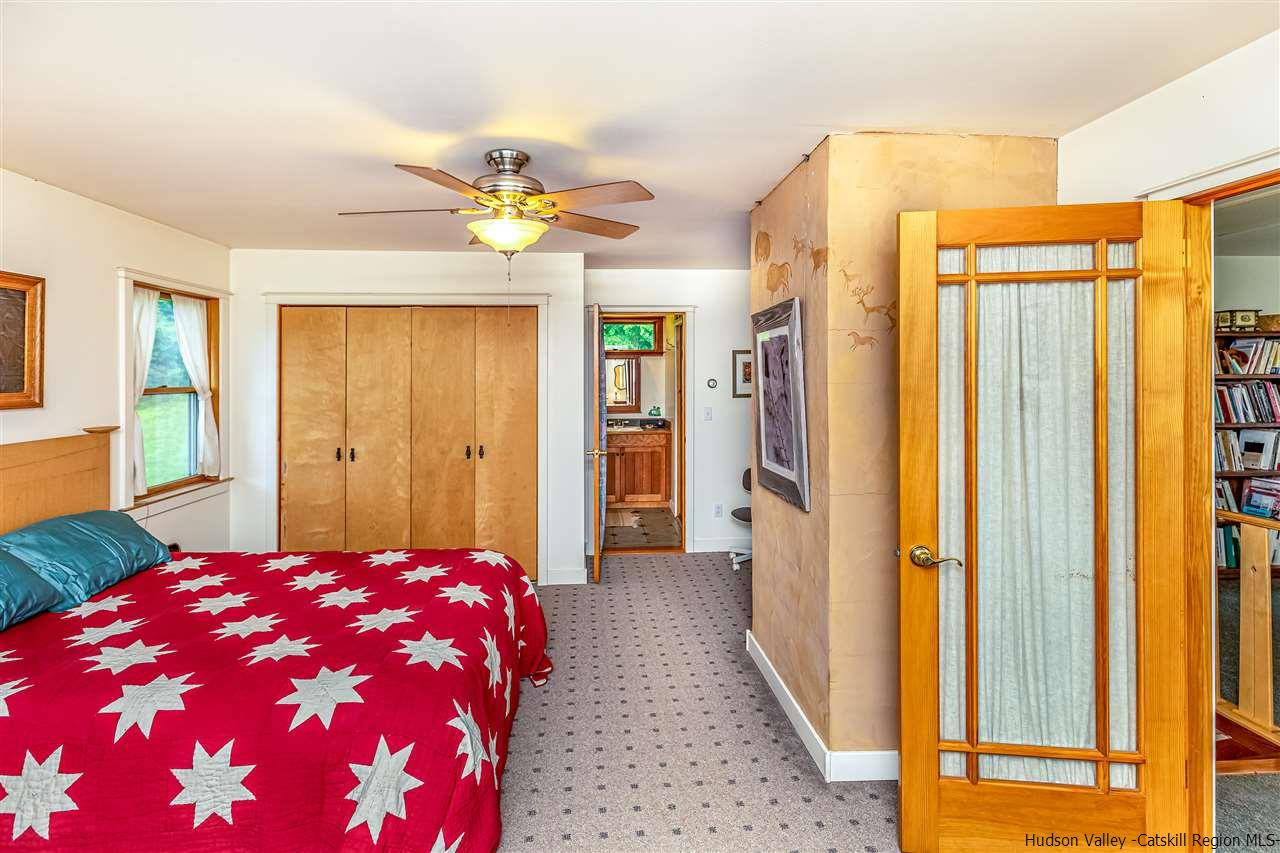 151 Wilhelm Road Saugerties, NY 12477 - Photo 21 of 35 a bedroom with a bed closet and a window