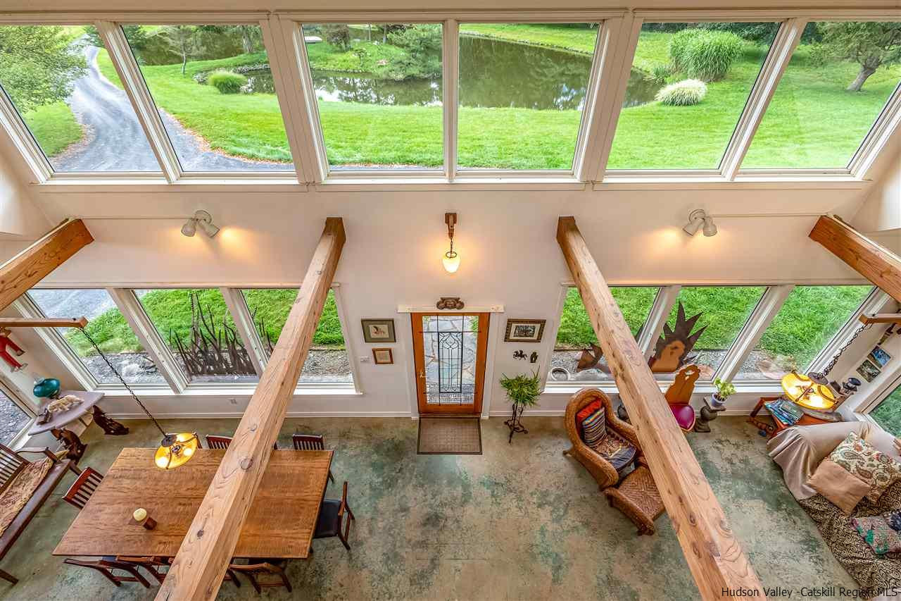 151 Wilhelm Road Saugerties, NY 12477 - Photo 27 of 35 a view of a living room with a floor to ceiling window