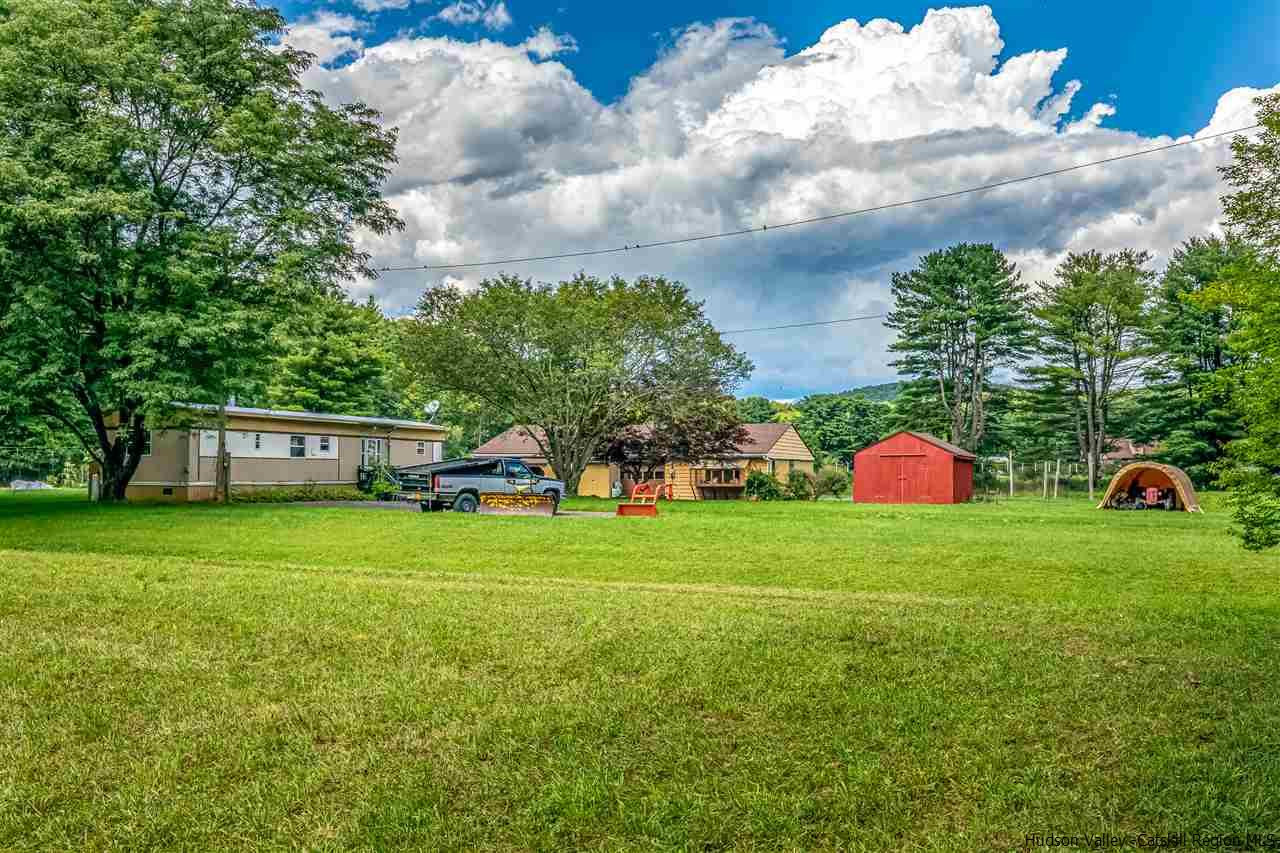 151 Wilhelm Road Saugerties, NY 12477 - Photo 31 of 35 a front view of a house with a yard and trees