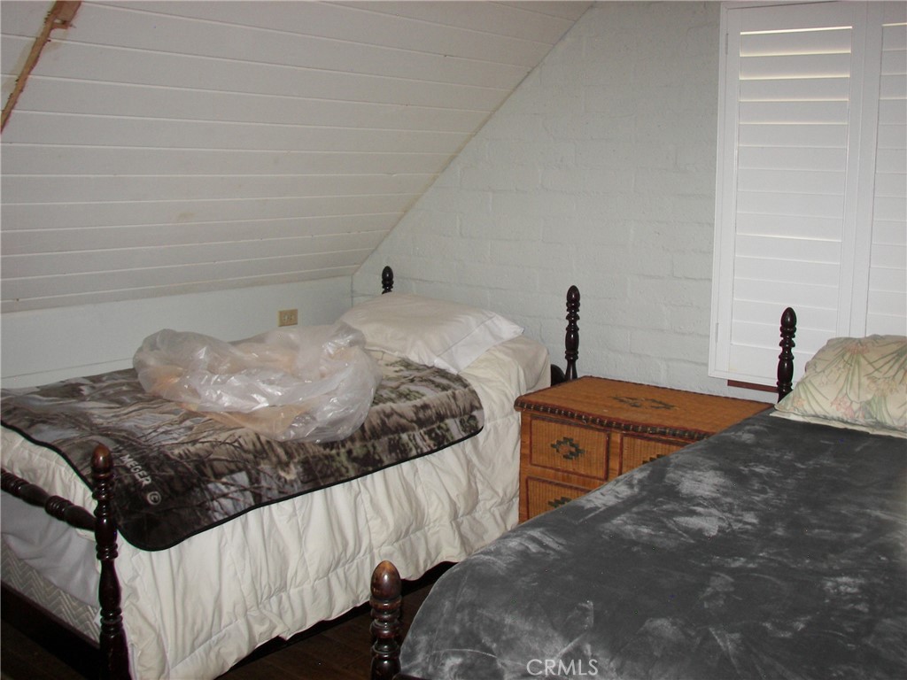 1101 Big Tree Lane Crestline, CA 92325 - Photo 18 of 30 a bedroom with two beds and a window