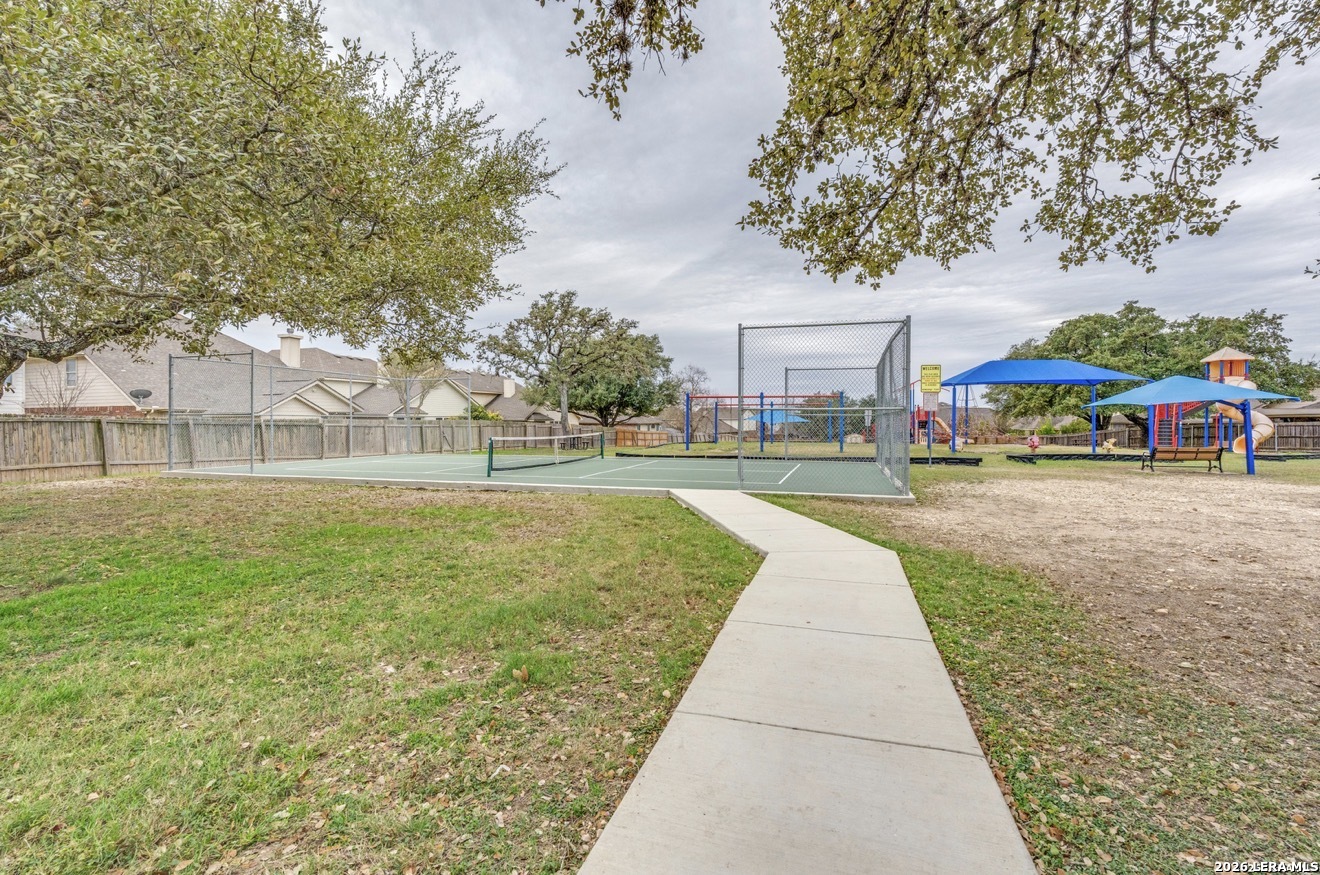 1921 Walter Raleigh Windcrest, TX 78239 - Photo 24 of 24 a view of outdoor space with garden and trees