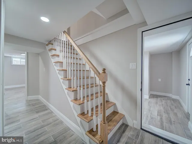 a view of room with wooden floor