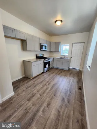 a view of a livingroom with wooden floor
