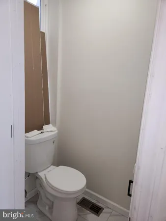 a view of an empty room with windows