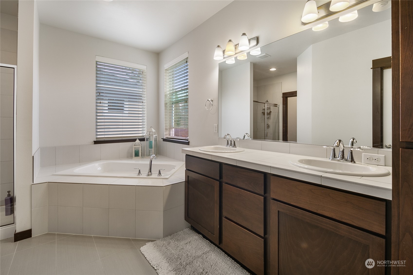17601 3rd Avenue Southeast Bothell, WA 98012 - Photo 16 of 31 a bathroom with a tub double sink and mirror