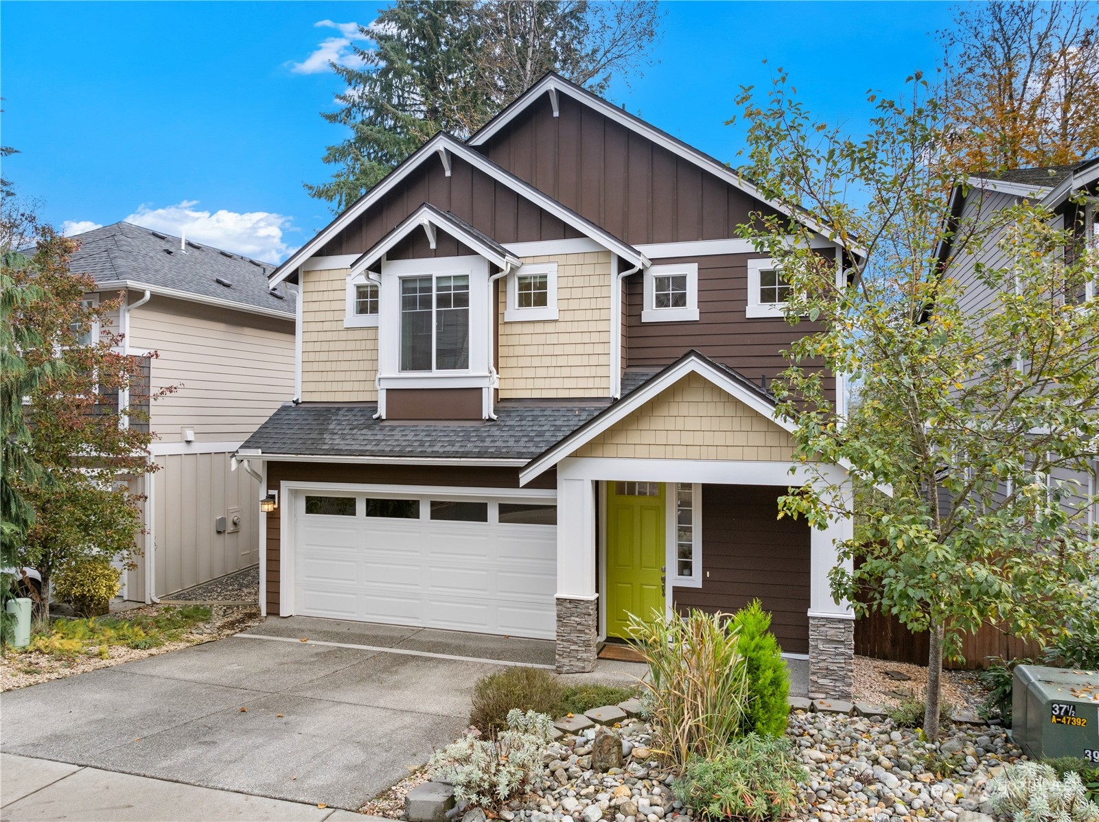 17601 3rd Avenue Southeast Bothell, WA 98012 - Photo 29 of 31 a front view of a house with a garden and plants