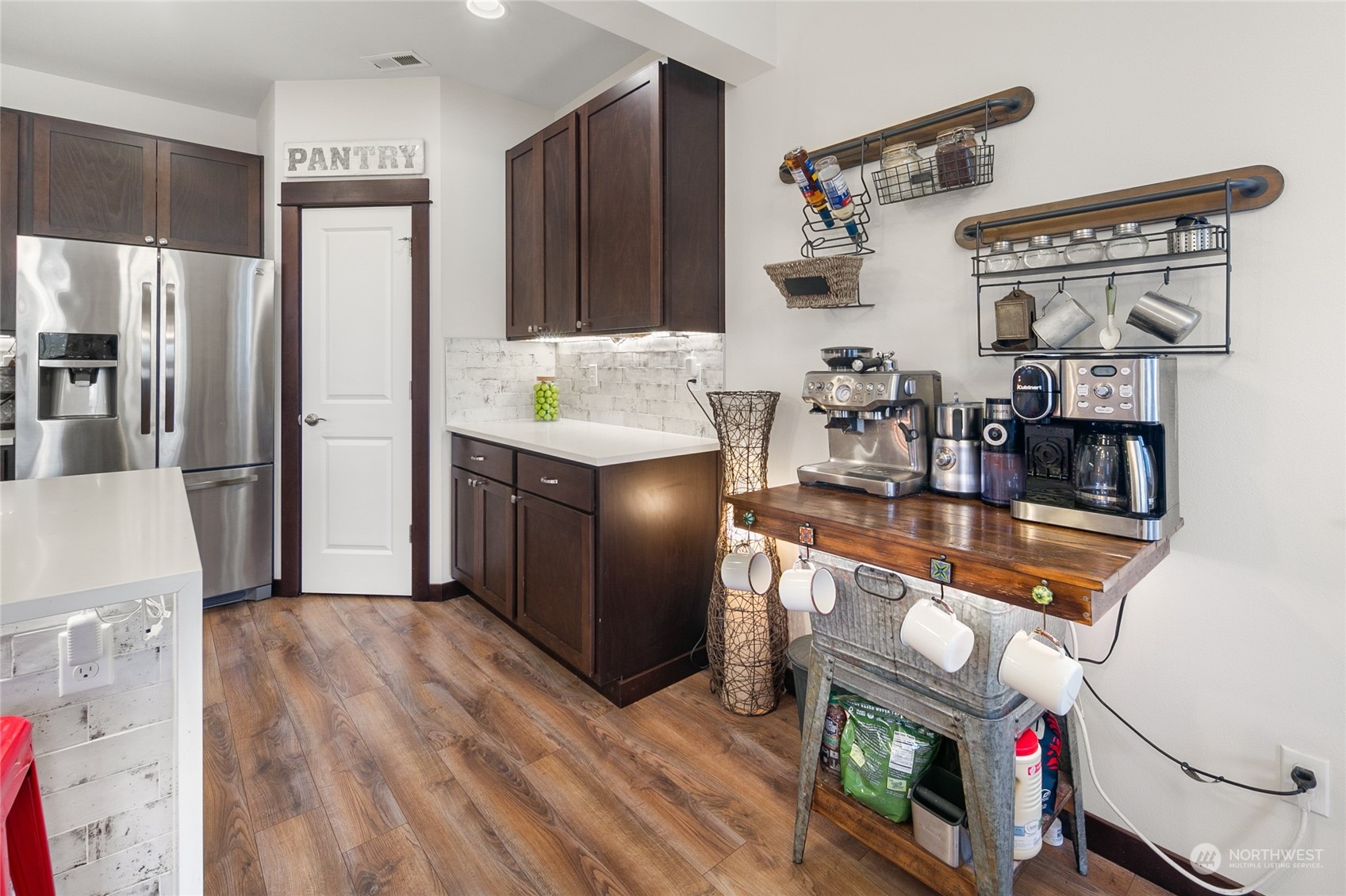 17601 3rd Avenue Southeast Bothell, WA 98012 - Photo 10 of 31 a kitchen with stainless steel appliances granite countertop a refrigerator and a stove