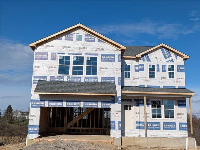 a front view of a house with glass windows