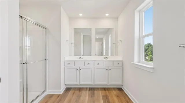a view of a bathroom with a tub and shower