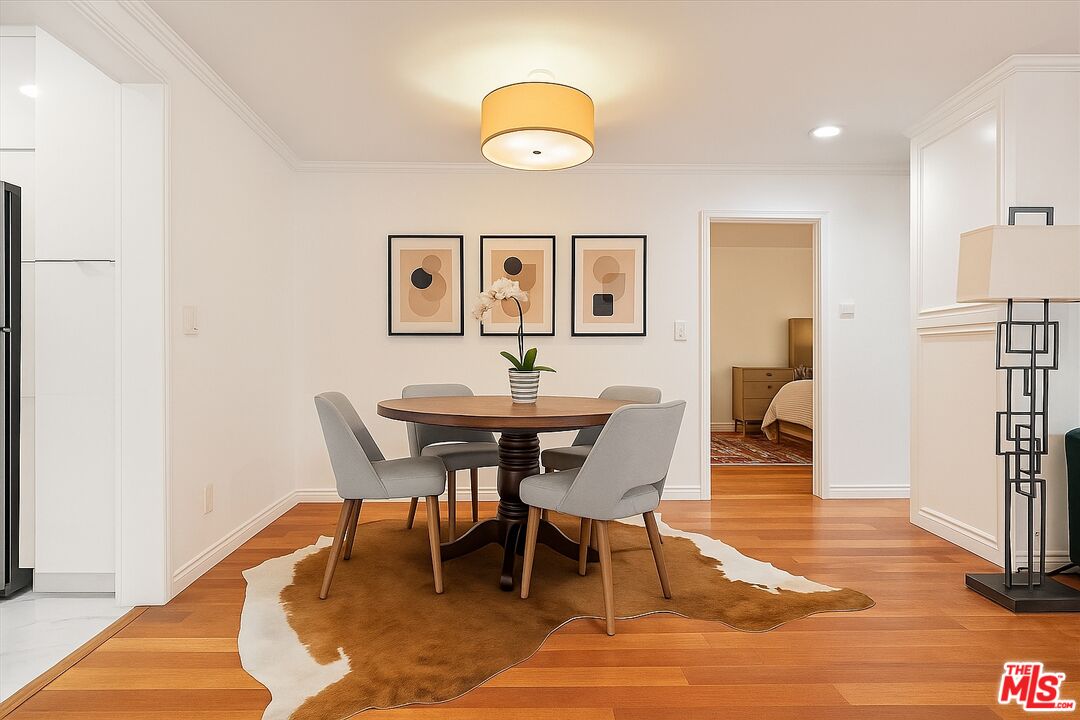 1327 Stanford Street, Unit 3 Santa Monica, CA 90404 - Photo 3 of 12 a view of a dining room with furniture and wooden floor