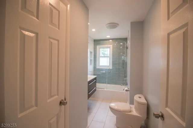 a bathroom with a toilet a sink and bathtub