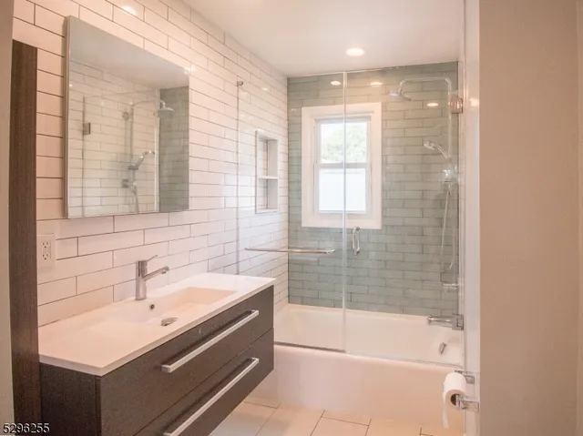 a bathroom with a bathtub and a sink