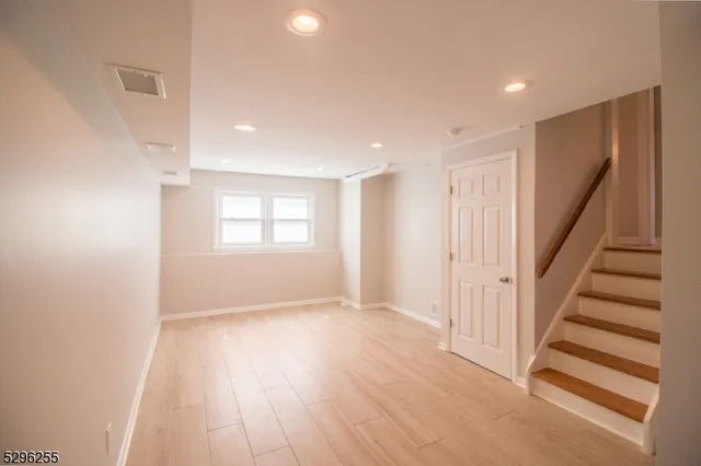 a view of entryway with wooden floor