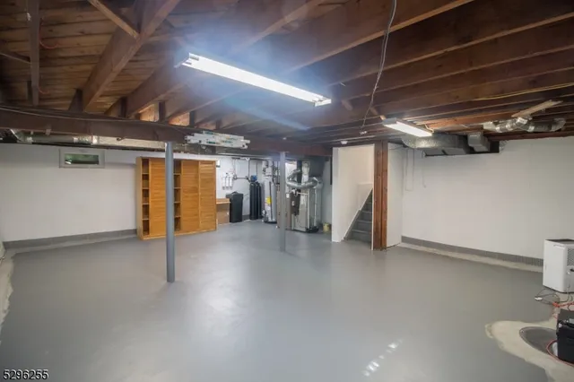 a view of empty room with wooden ceiling