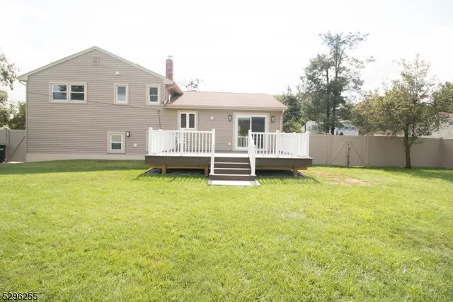 a view of a house with a backyard
