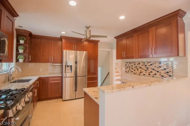 a kitchen with a refrigerator sink and stove