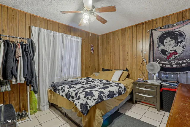 a bedroom with a bed and a walk in closet