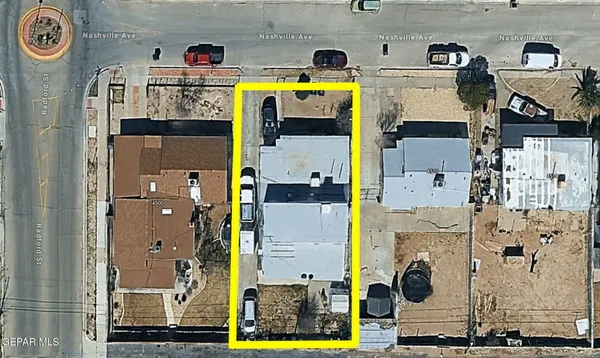 an aerial view of residential house with outdoor space and parking