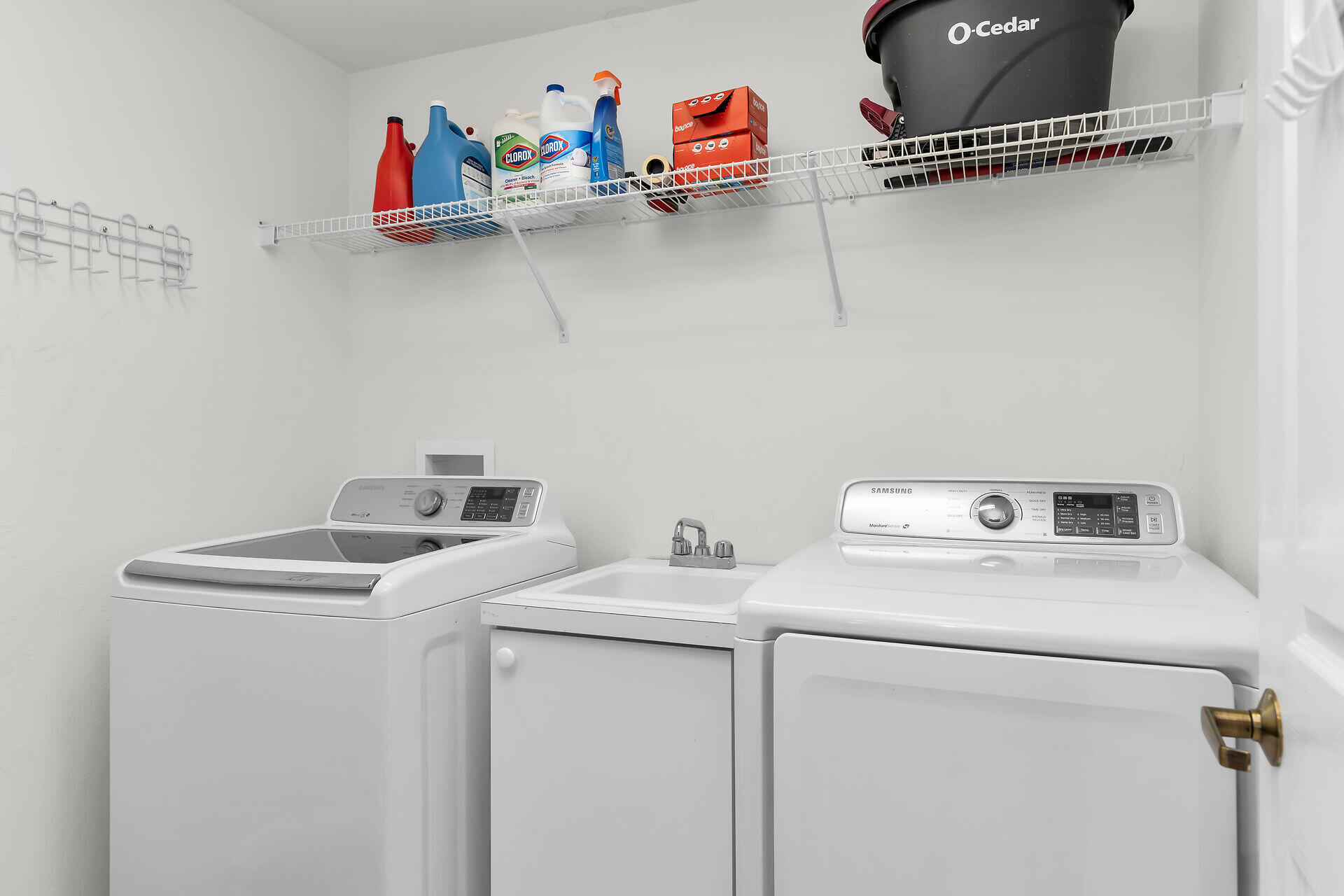 1111 Swallow Avenue, Unit 1401 Marco Island, FL 34145 - Photo 31 of 36 a utility room with dryer and washer