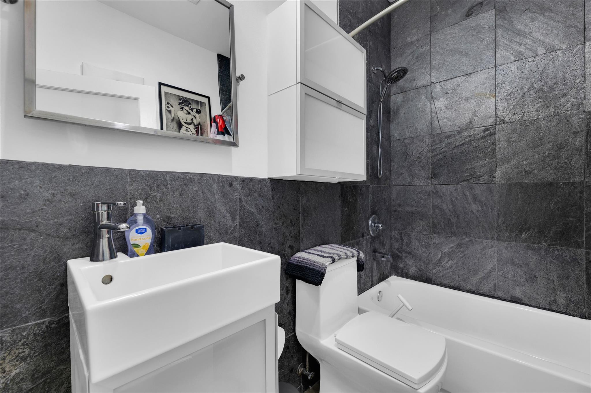303 Southwest 9th Street Fort Lauderdale, FL 33315 - Photo 17 of 49 a bathroom with a sink and bathtub