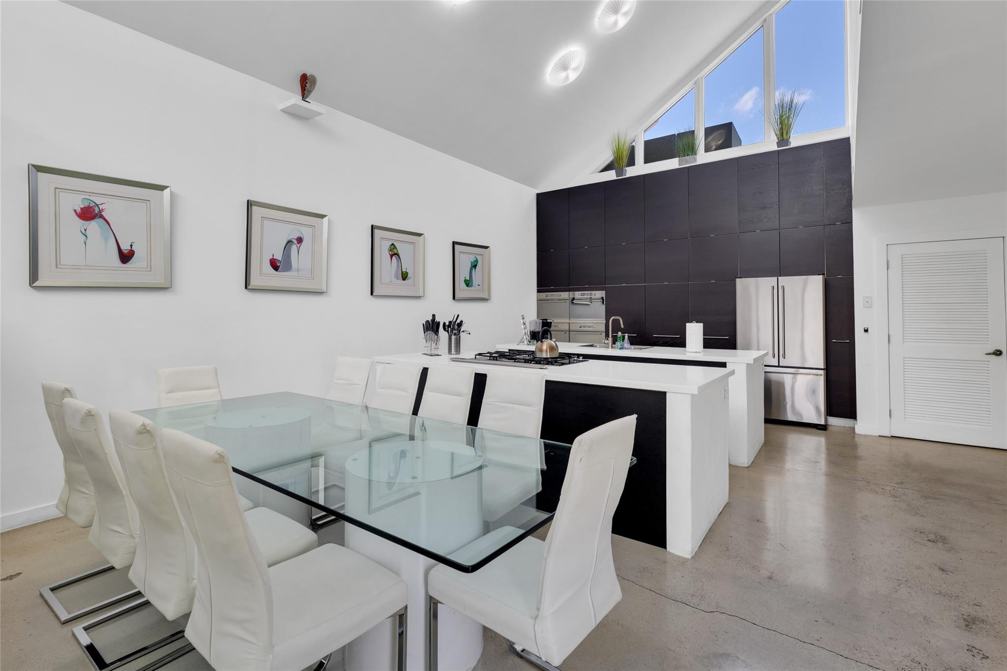 303 Southwest 9th Street Fort Lauderdale, FL 33315 - Photo 3 of 49 a dining room with furniture and a kitchen view