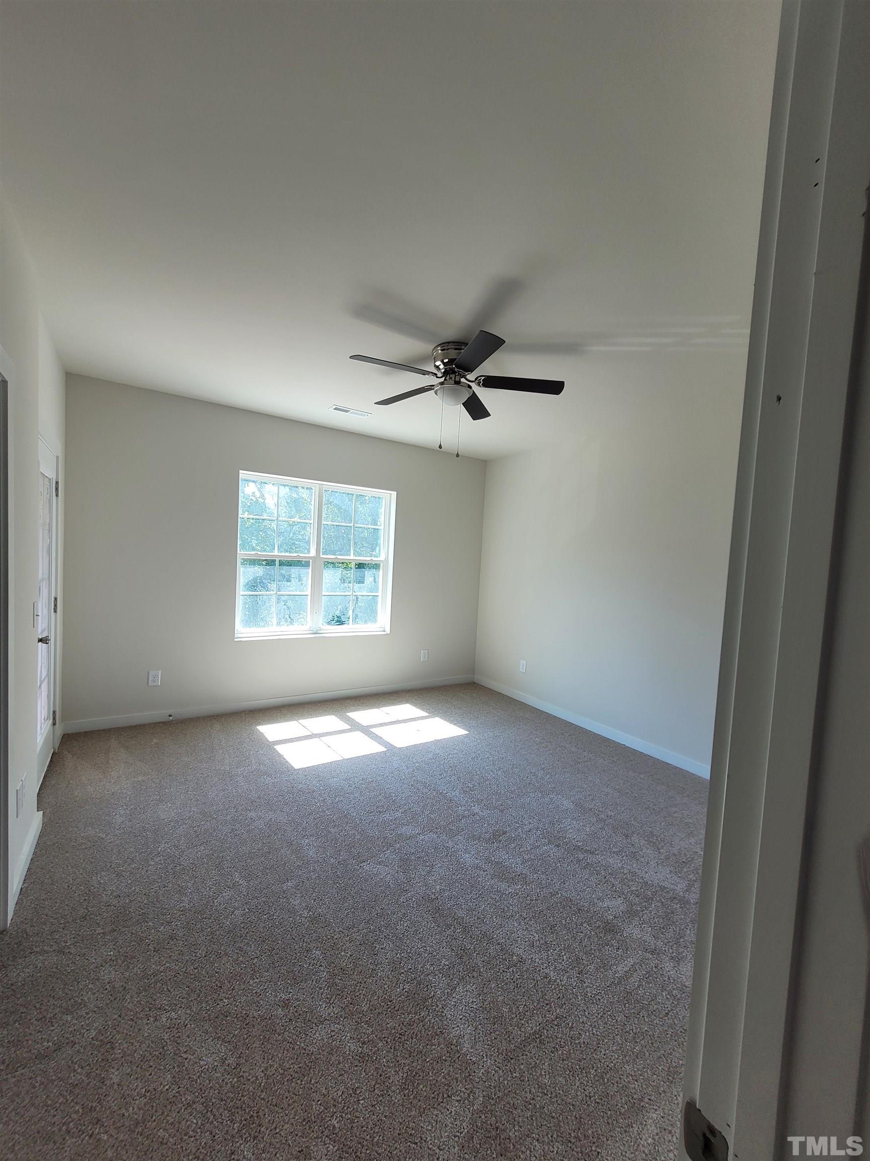 806 Laurel Gate Drive Wake Forest, NC 27587 - Photo 15 of 19 an empty room with a window