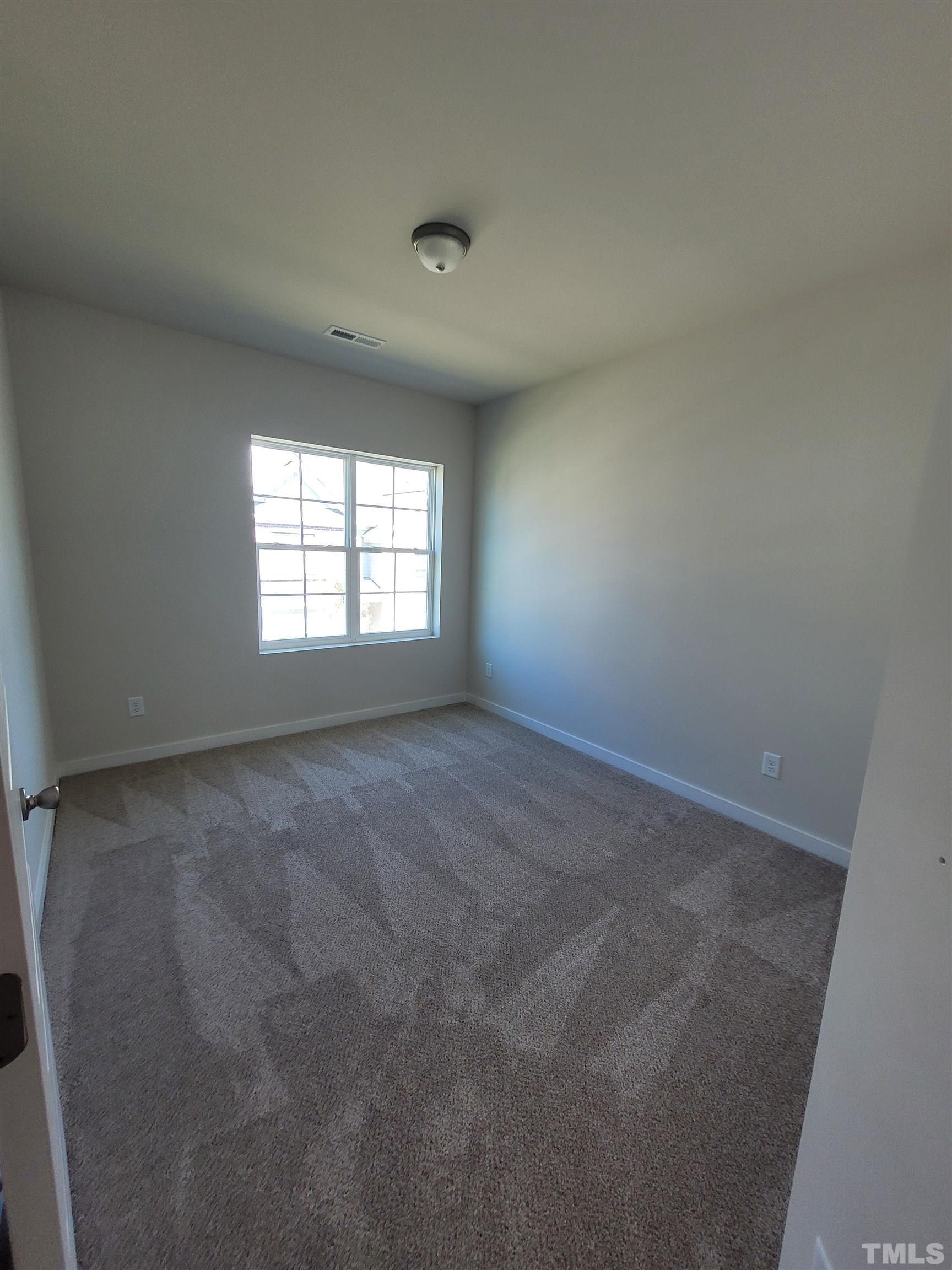 806 Laurel Gate Drive Wake Forest, NC 27587 - Photo 18 of 19 an empty room with a window