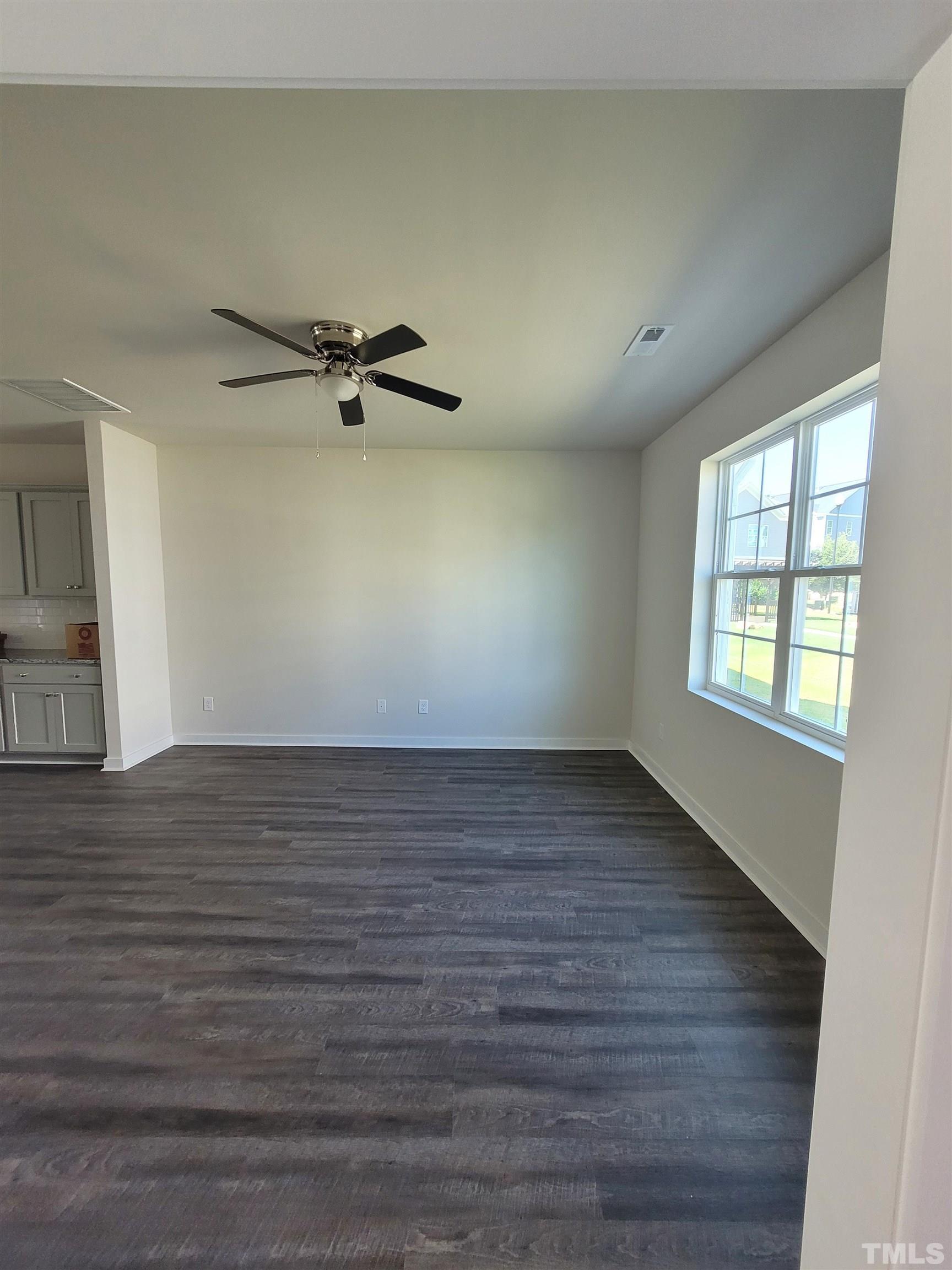 806 Laurel Gate Drive Wake Forest, NC 27587 - Photo 3 of 19 wooden floor in an empty room with a window