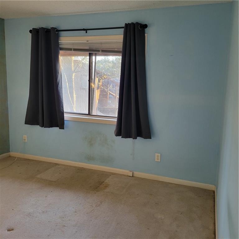 7 Quail Run Decatur, GA 30035 - Photo 7 of 7 a bathroom with a window and a shower