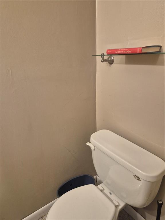 7 Quail Run Decatur, GA 30035 - Photo 8 of 16 a white toilet sitting next to a white wall