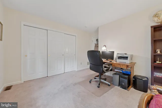 a view of a workspace with furniture