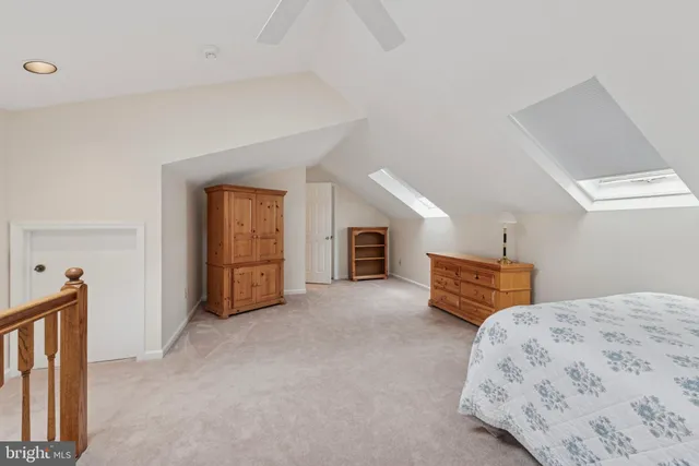 a bedroom with furniture and a window