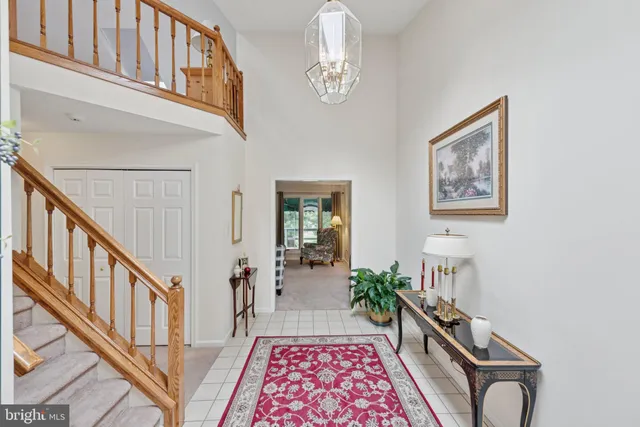 a view of a hallway with furniture
