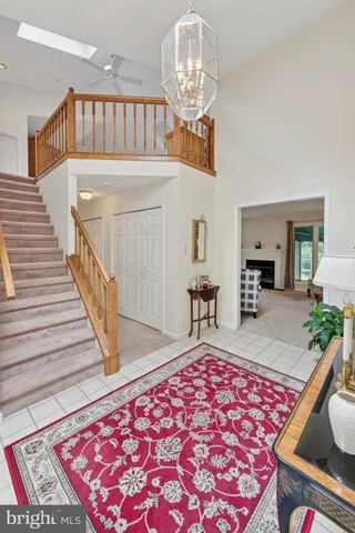 a living room with a rug and a table