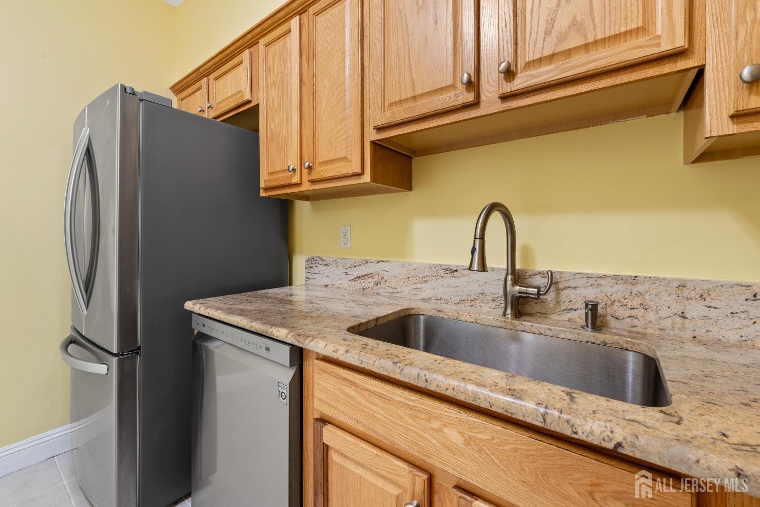 540 Cranbury Road East Brunswick, NJ 08816 - Photo 13 of 33 a kitchen with stainless steel appliances granite countertop a refrigerator and a sink