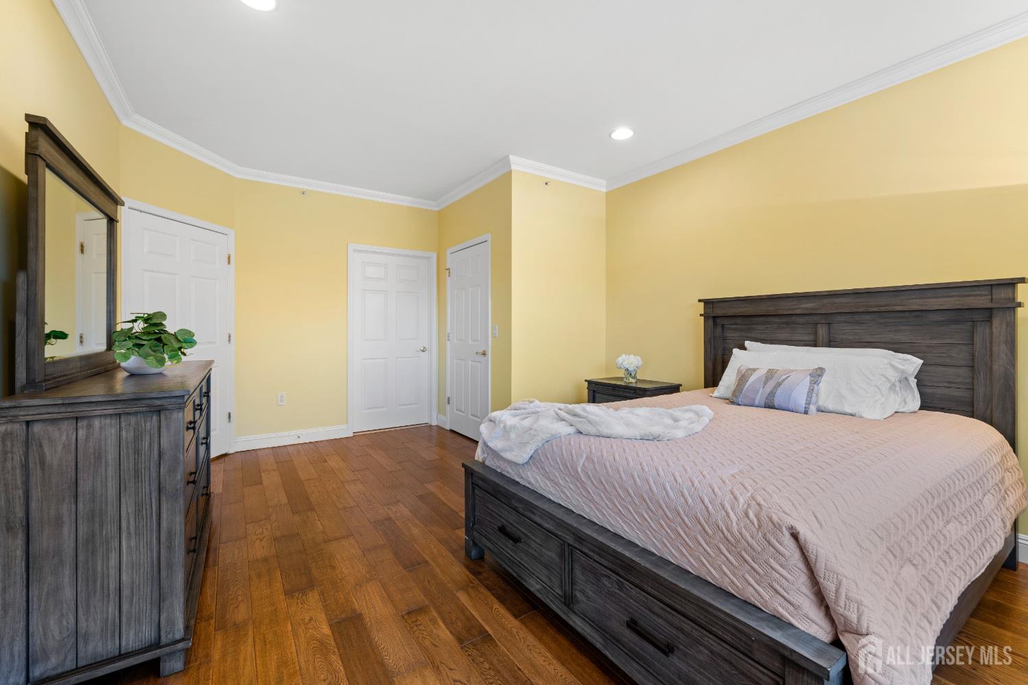540 Cranbury Road East Brunswick, NJ 08816 - Photo 16 of 33 a bedroom with a bed and wooden floor