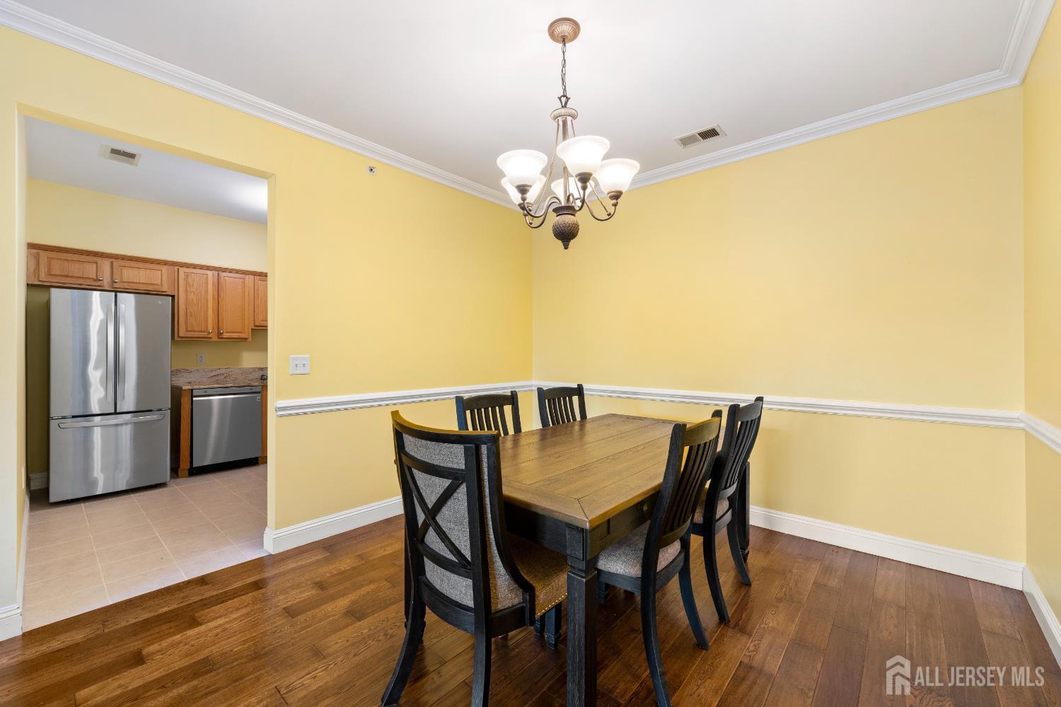 540 Cranbury Road East Brunswick, NJ 08816 - Photo 5 of 33 a view of a dining room a chandelier and wooden floor