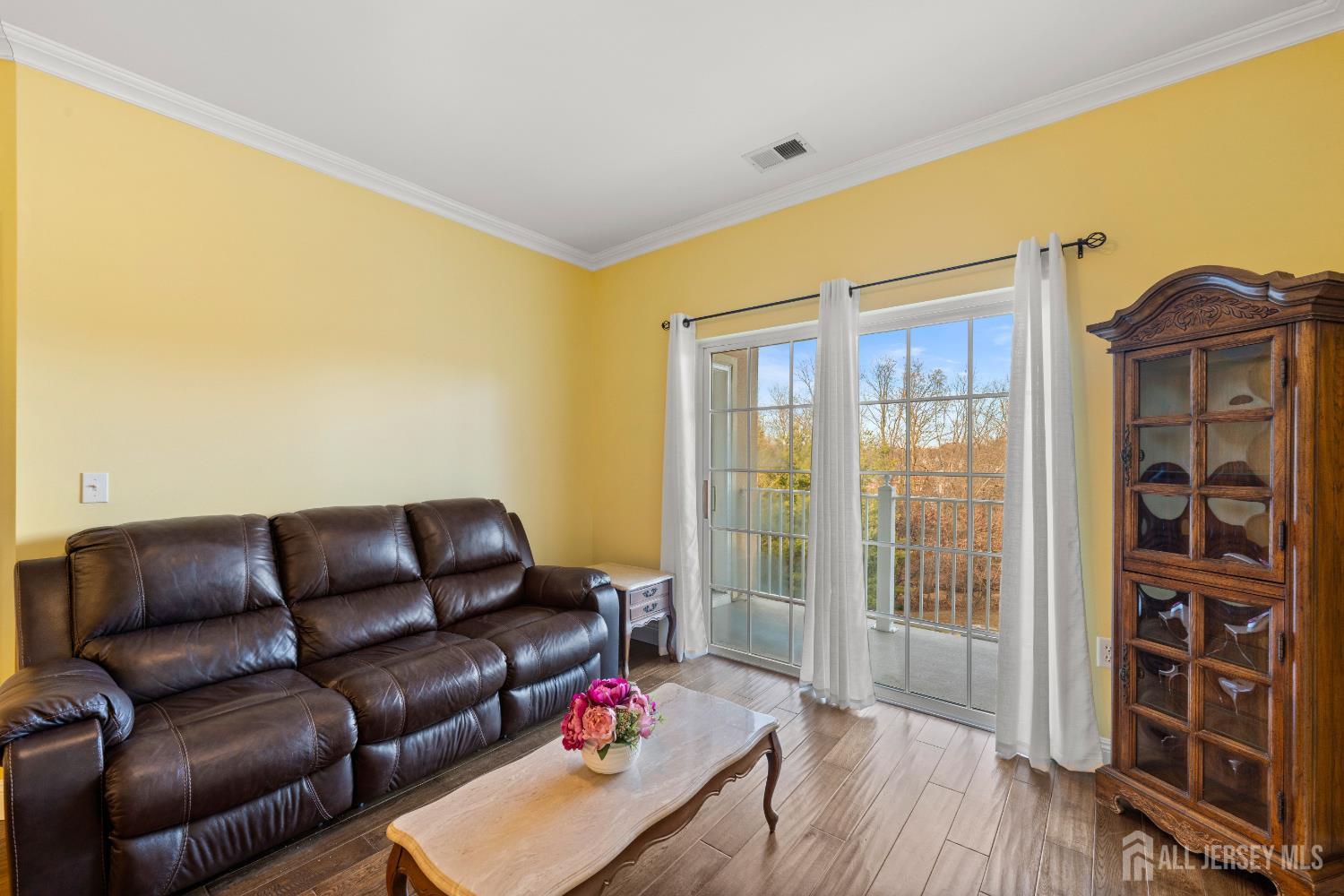 540 Cranbury Road East Brunswick, NJ 08816 - Photo 7 of 33 a living room with furniture and a floor to ceiling window