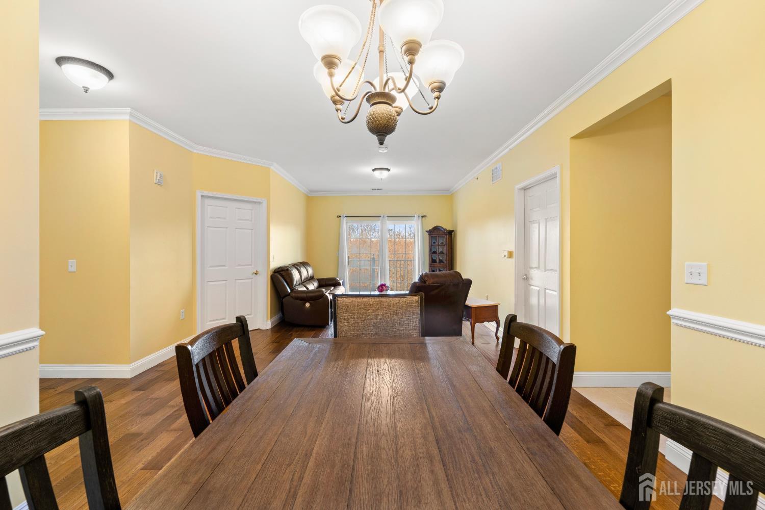 540 Cranbury Road East Brunswick, NJ 08816 - Photo 9 of 33 a living room with furniture a dining table and wooden floor