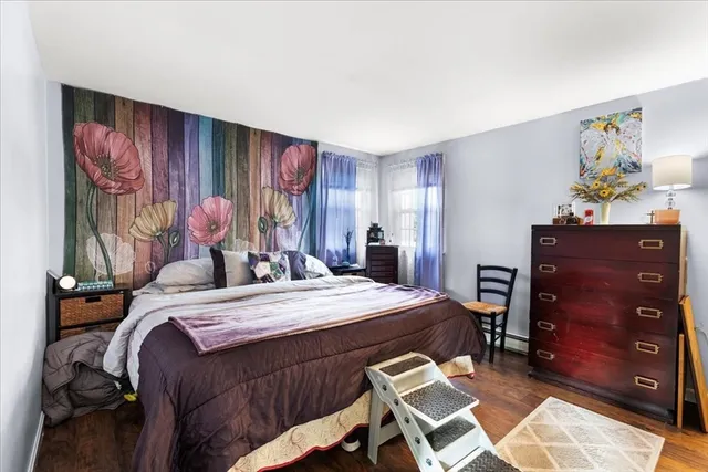 a bed room with a bed and a dresser