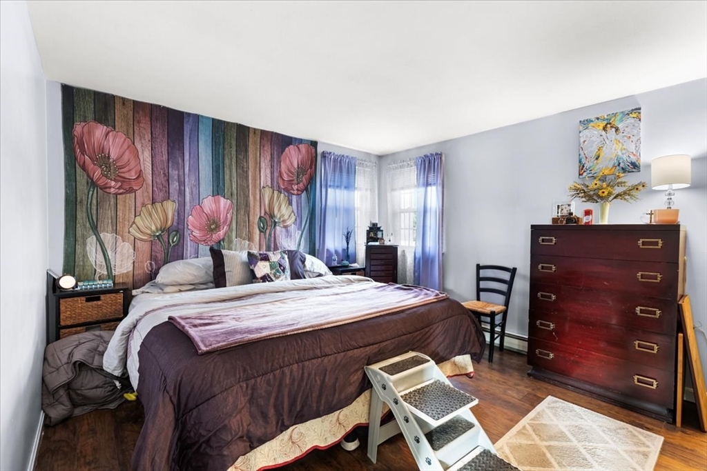 107 Ann Street Raynham, MA 02767 - Photo 18 of 34 a bed room with a bed and a dresser