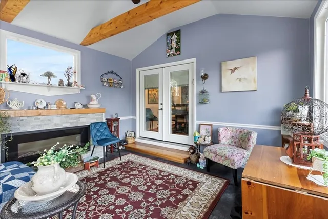 a living room with furniture and a rug