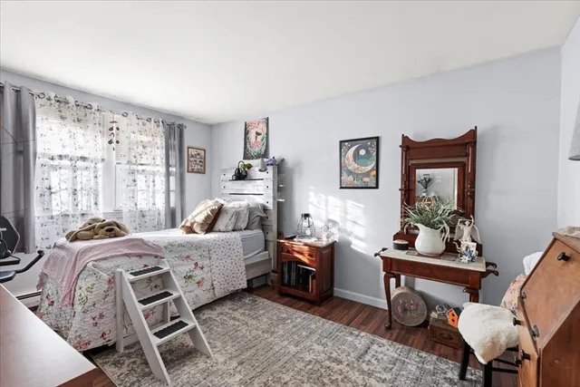 a bed room with furniture and a window