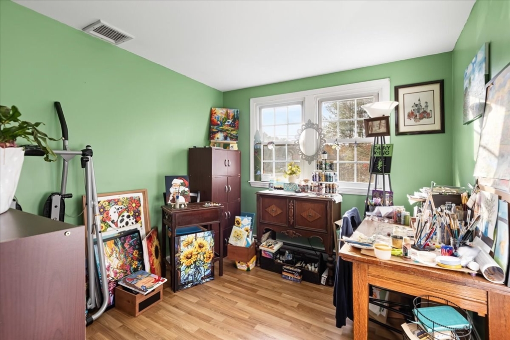 107 Ann Street Raynham, MA 02767 - Photo 23 of 34 a bedroom with furniture and a wooden floor
